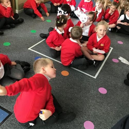 Re-enacting A Squash and a Squeeze to develop an understanding of more and fewer