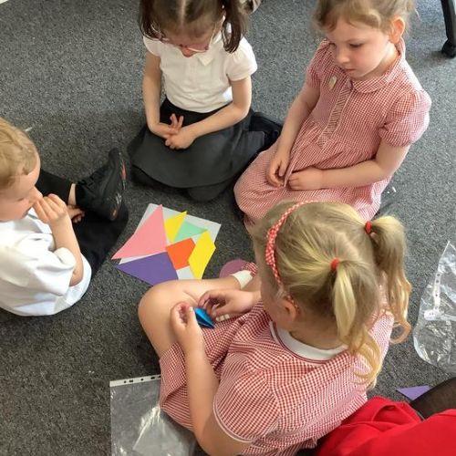 Manipulating shapes- the children used 2d shapes to make a tangram puzzles.