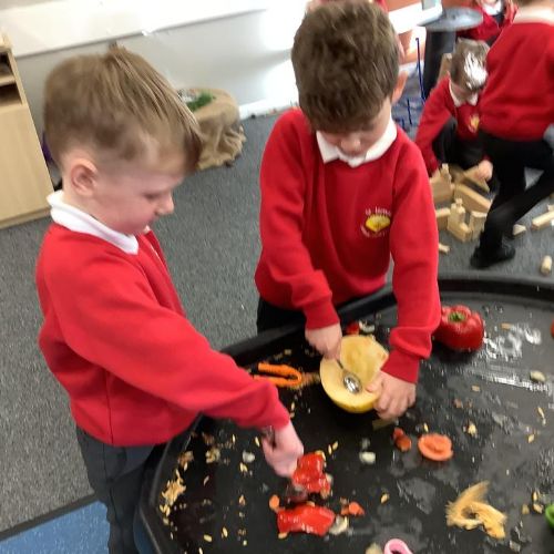 We explored fruits and vegetables, cutting and slicing them.